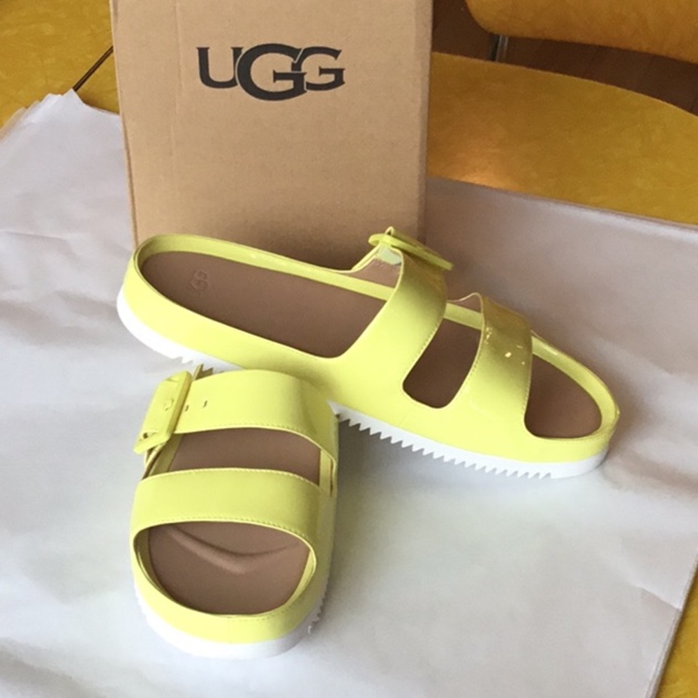 UGG yellow slip on sandals. New in box.